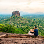 Couple In Sigiriya, Rock View. Woman And Man, Summer Travel. People On Vacation In Sri Lanka. Beautiful Nature With Green Landscape And Mountains. Romance On Pidurangala. Couple In Sigiriya, Rock View. Woman And Man, Summer Travel. People On Vacation In Sri Lanka. Beautiful Nature With Green Landscape And Mountains. Romance On Pidurangala.